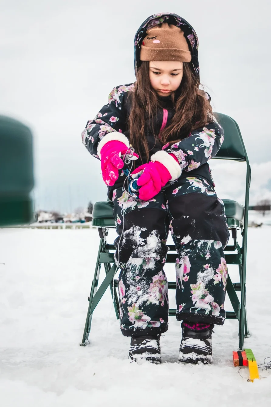 Image of a little girl ice fishing